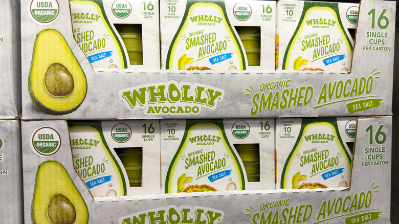 A Costco display of Wholly Smashed Avocado single-serving cups