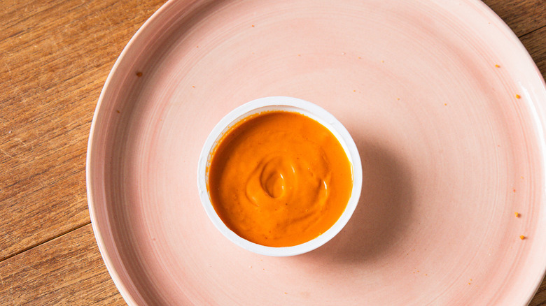 Overhead view of the Flamin' Hot Dip Cup on a pink plate