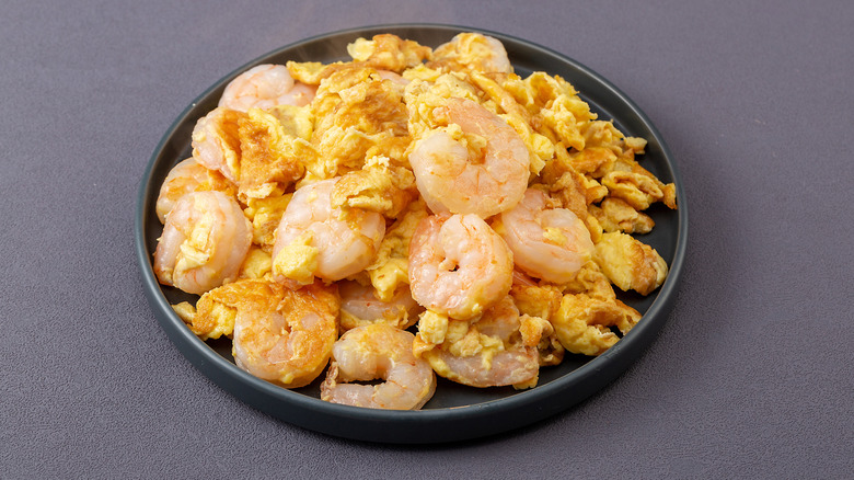 Plate of scrambled eggs with shrimp