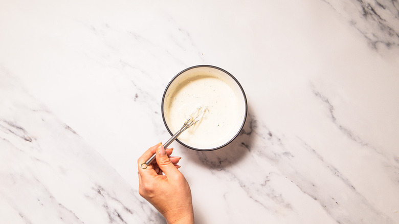 Mixing ranch sauce in bowl