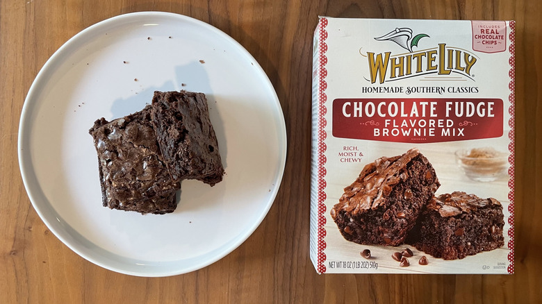 White Lily chocolate fudge flavored brownie mix box and baked brownies on a plate