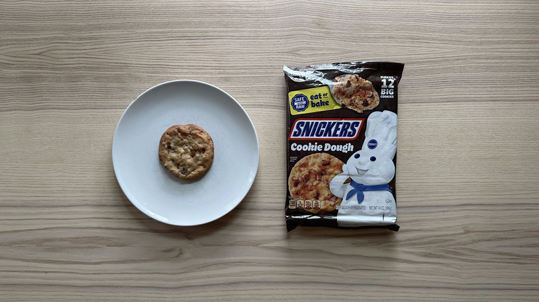 Pillsbury Snickers cookie dough on wooden table