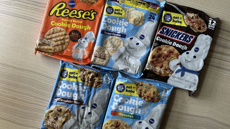 Packages of Pillsbury ready-to-bake cookie dough on wooden table