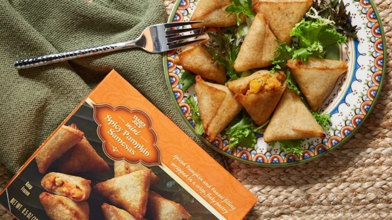 A plate of Trader Joe's Mini Spicy Pumpkin Samosas with a fork and napkin