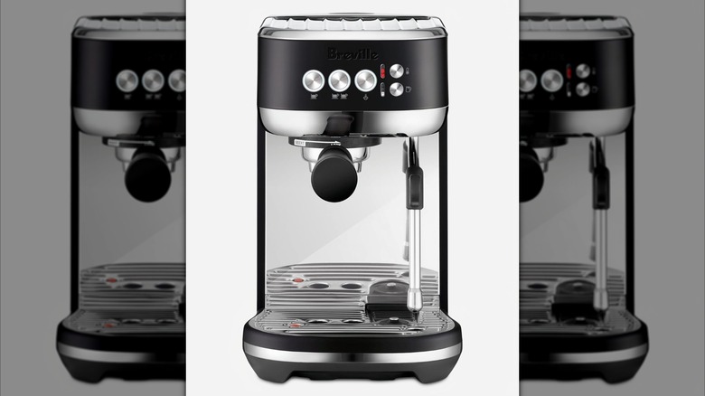Product image of the Breville Bambino Plus espresso machine in black color.