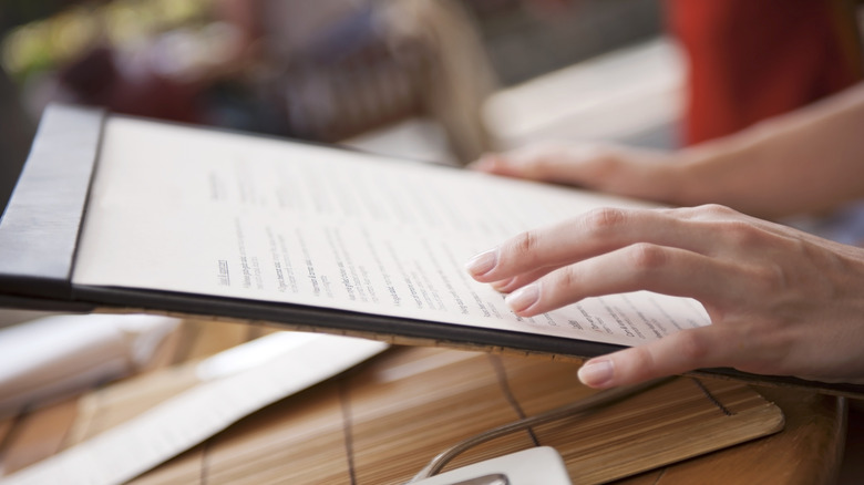 Person scanning a restaurant menu