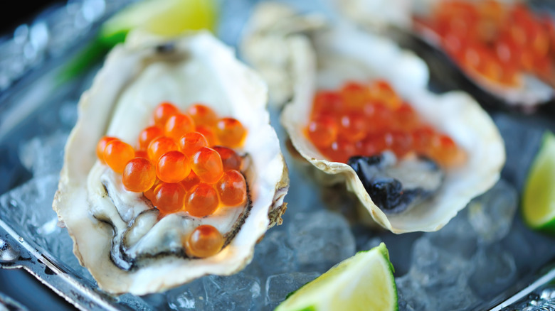 Close-up of an oyster filled with caviar