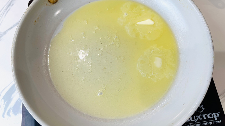 Melted butter in large pan