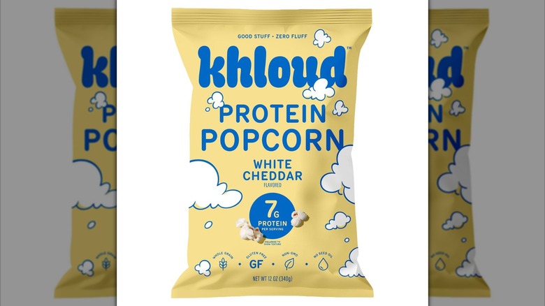 Pale yellow bag of Khloud Protein White Cheddar Popcorn