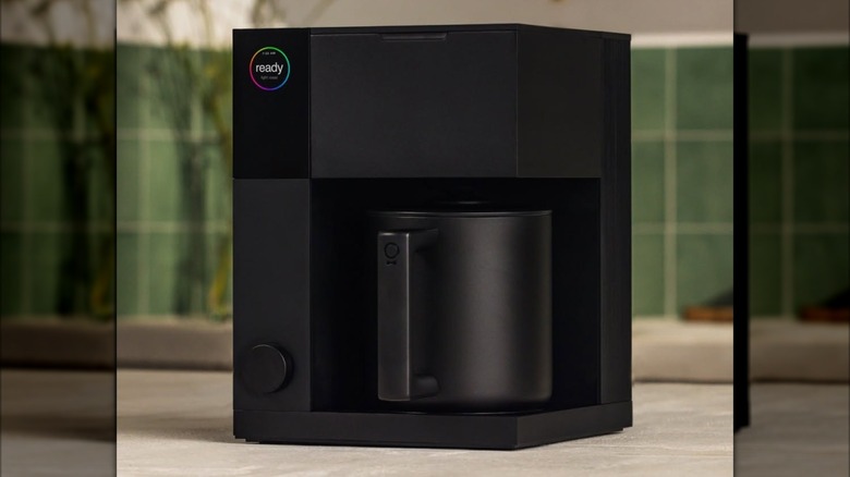 A matte black Fellow Aiden Precision Coffee Maker on a kitchen counter