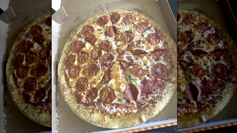 A Pepperoni pizza with a pretzel crust from Little Caesars sits in a box