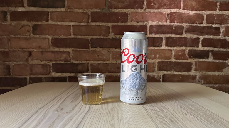 Coors Light beer in small glass on table