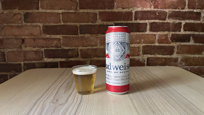 Budweiser beer in small glass on table