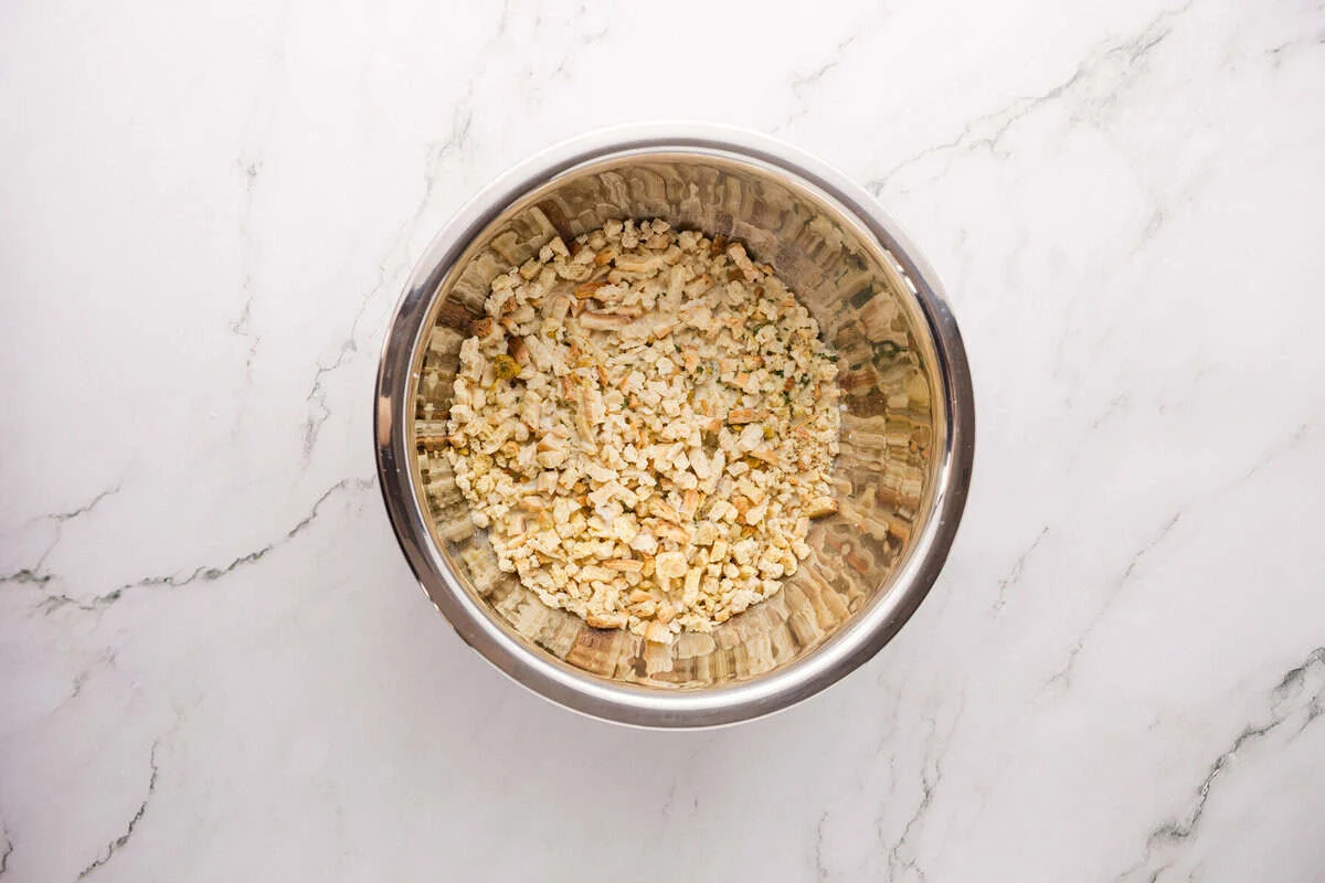 Stove Top stuffing mix in a stainless steel bowl before adding milk
