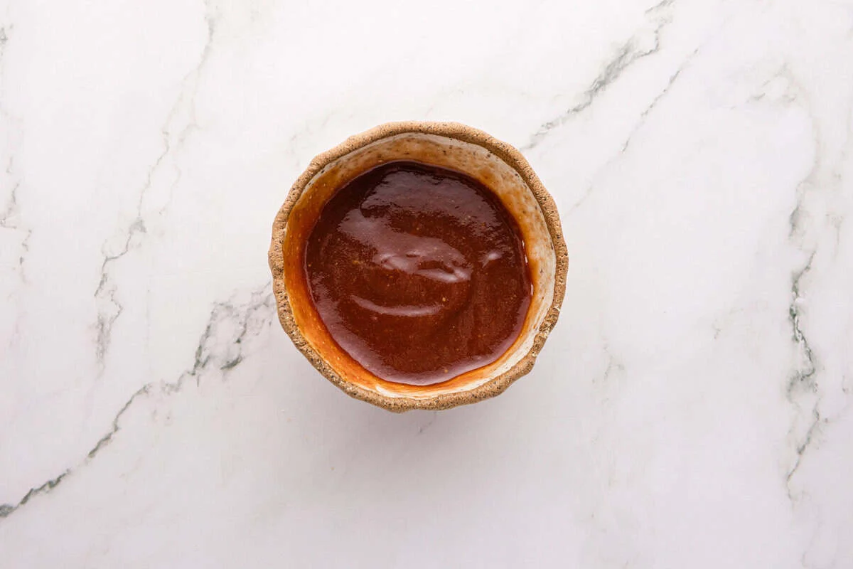 Sweet and tangy ketchup glaze with brown sugar and Worcestershire sauce in a small bowl