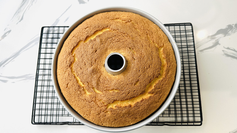 Baked chiffon cake in tube pan on wire rack