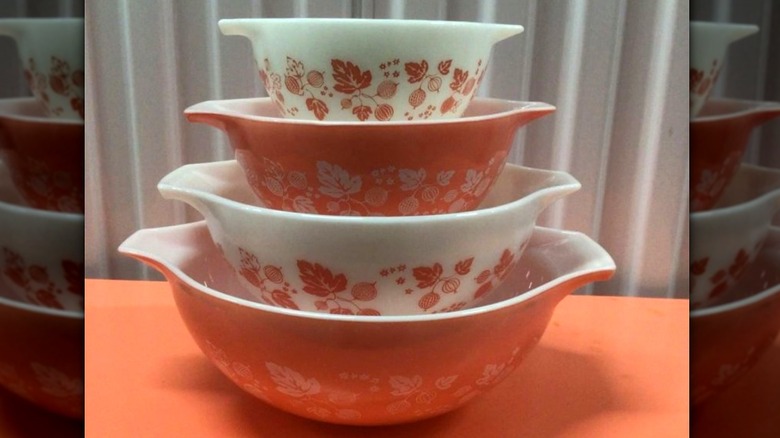 A stack of pink Gooseberry Pyrex dishes