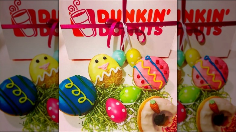 Mirrored image of Easter donuts in front of Dunkin' Donuts box