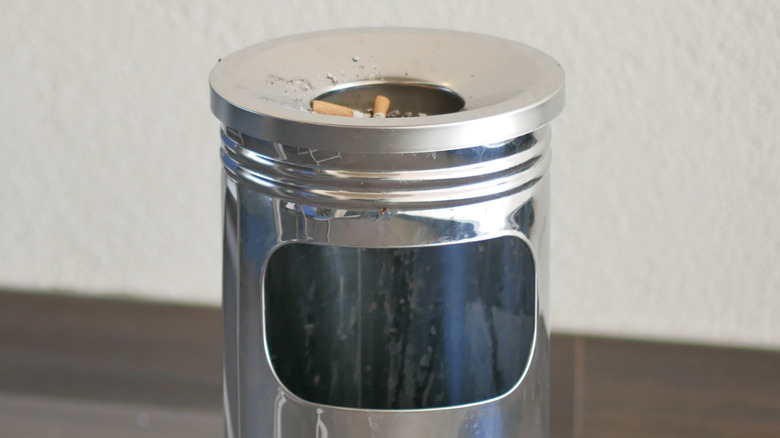 Close-up of metal standing ashtray