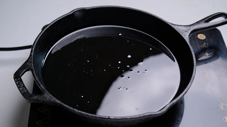 heating oil in a skillet