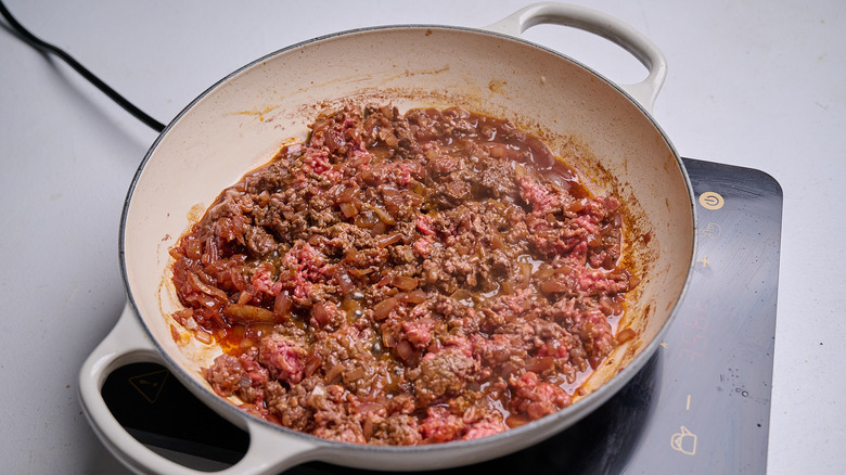 crumbling beef in a skillet