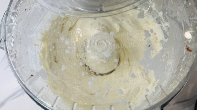 Cream cheese mixture in food processor with lid on