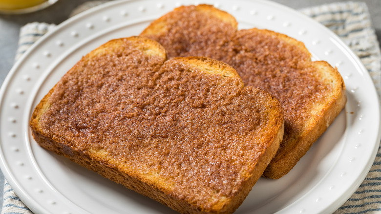 Two slices of cinnamon sugar toast on a plate
