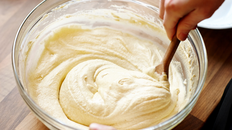 Close-up of cake batter being mixed in a bowl