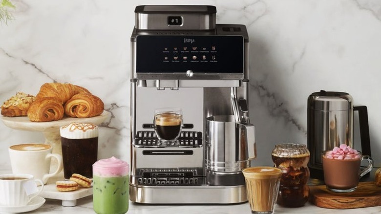 Ninja AutoBarista espresso maker alongside a variety of coffee drinks and pastries