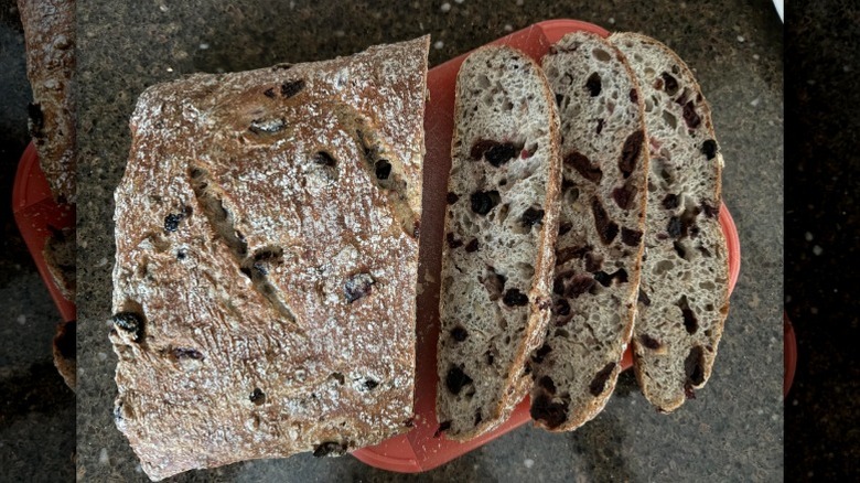 A sliced loaf of Costco's Cherry Berry Sourdough Bread on a plate
