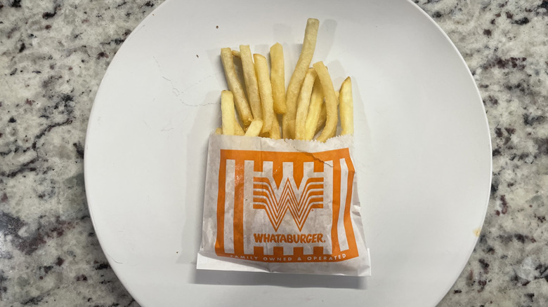 Whataburger French fries in container and on a plate