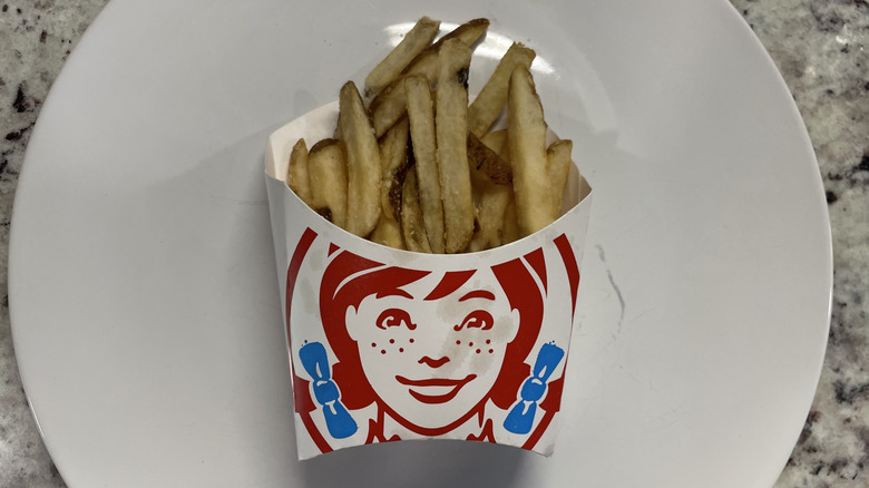 Wendy's Fries in a container and on a plate