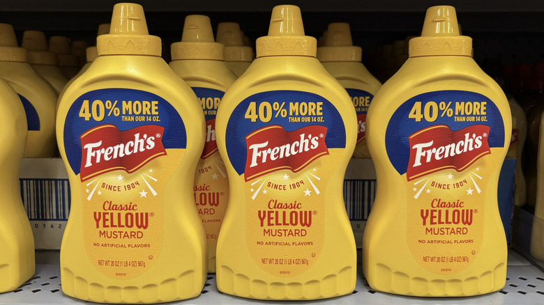 Bottles of French's mustard on a supermarket shelf