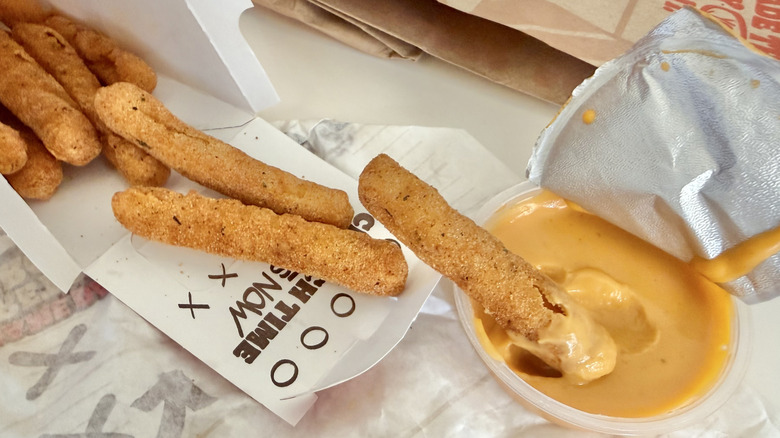 Chicken Fries and nacho sauce on a table
