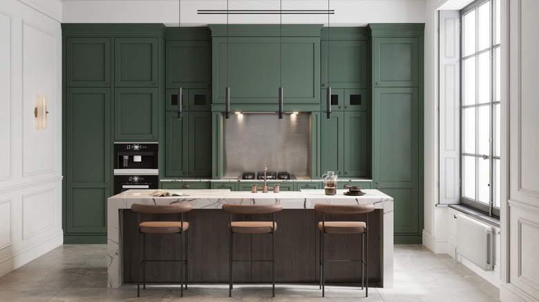 View of dark green and white kitchen