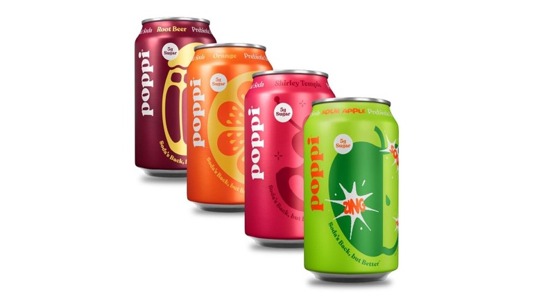 Four colorful cans of Poppi prebiotic soda