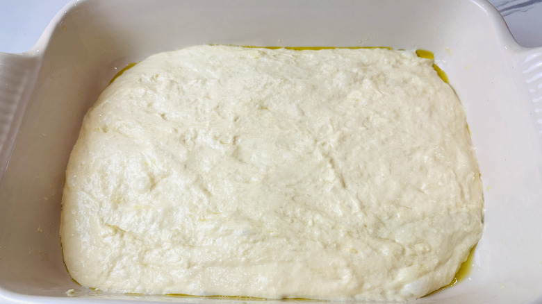Focaccia dough in baking dish