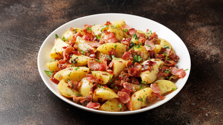 An old-fashioned German potato salad in a white plate