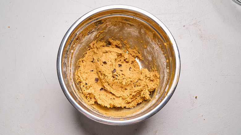 chocolate chunks stirred into cookie dough