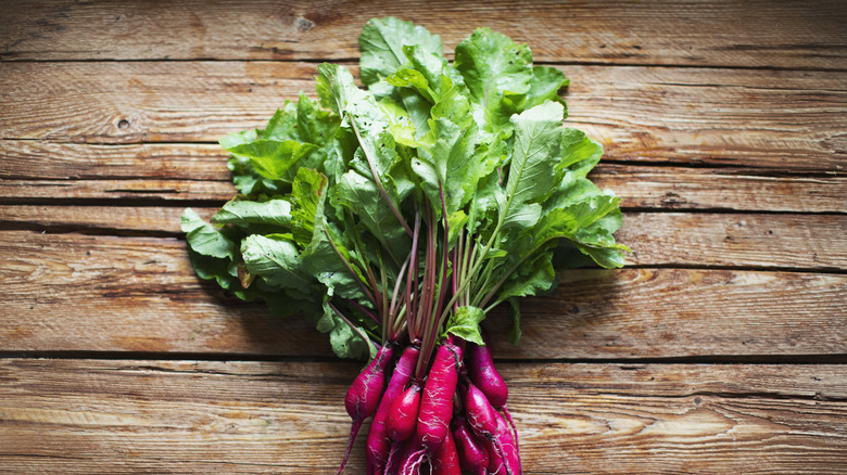 Beets with green stalks attached