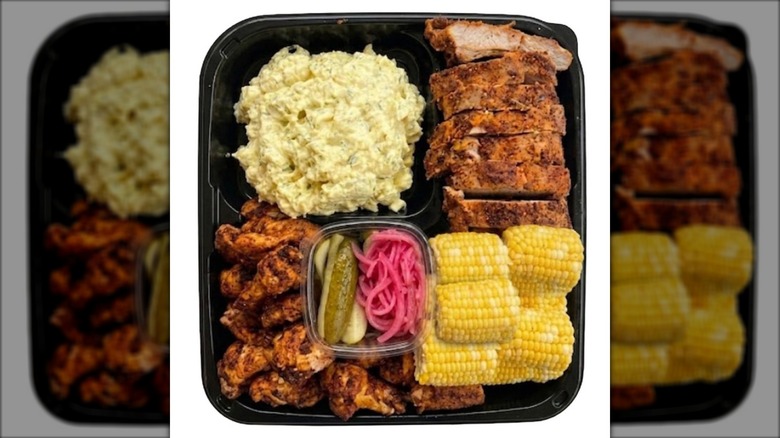 Costco's Barbecue Platter with chicken wings, ribs, potato salad, corn, pickles and pickled onions