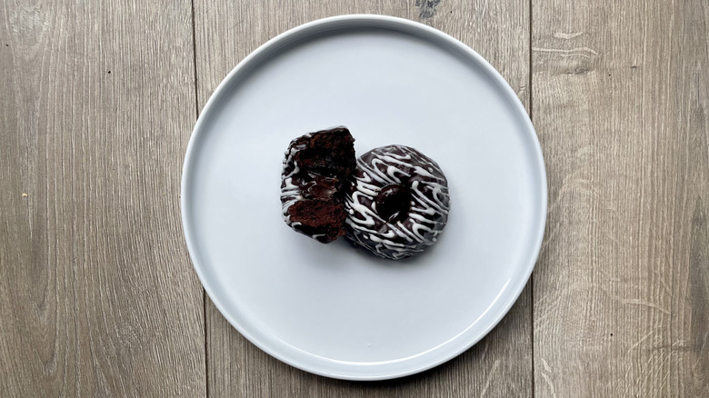 Publix Chocolate Petite Bundts sit on a white plate on a wooden table