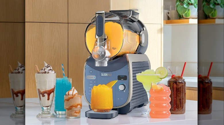 A Ninja SLUSHi MAX machine alongside a variety of frozen beverages