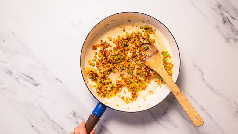 Carrot celery and onion in pan