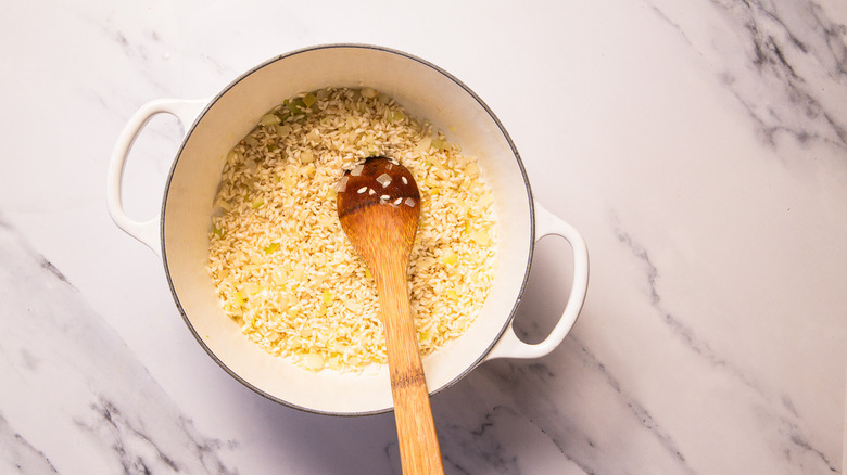 Rice and onion in pot