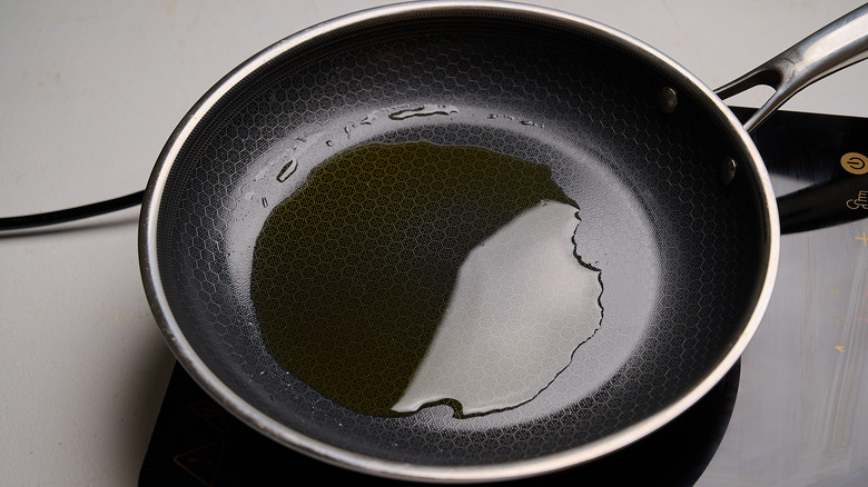 heating oil in a skillet