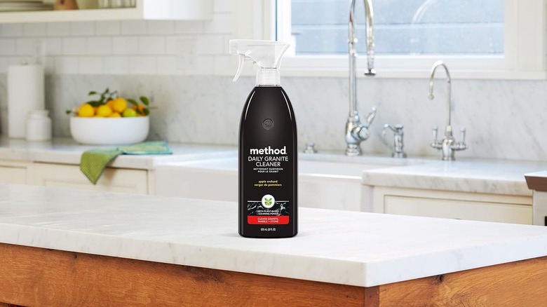 A bottle of Method Daily Granite Cleaner on a kitchen island