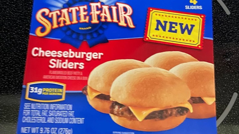 A box of State Fair Cheeseburger Sliders sitting on a stove top
