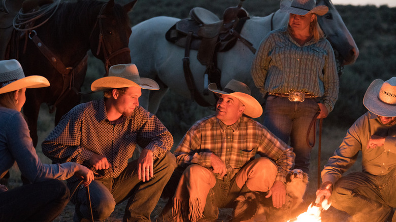 Modern cowboys tending to a fire