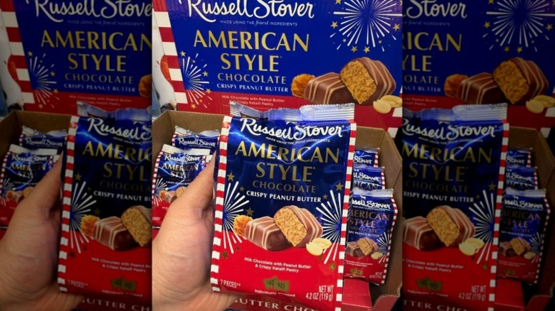 shopper holding Russell Stover candy